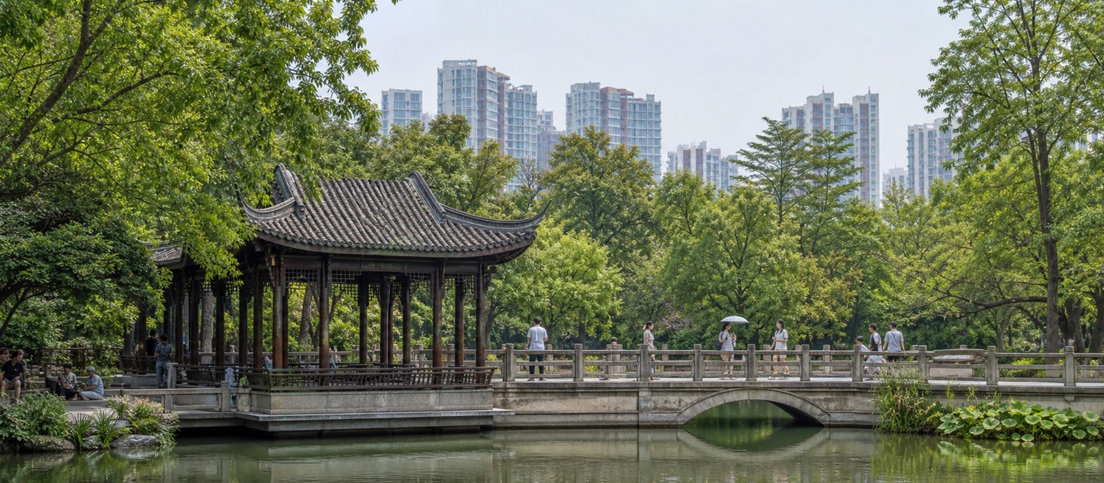 A traditional pavilion and bridge in a green Chengdu park
